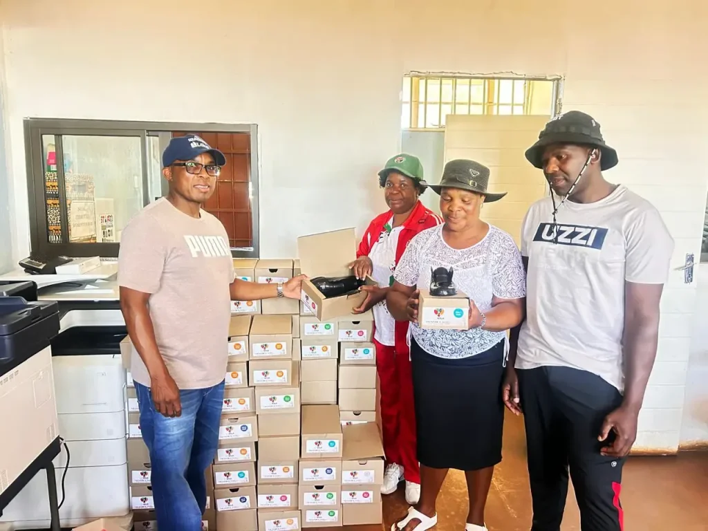 Sizanani team handing over donated school supplies