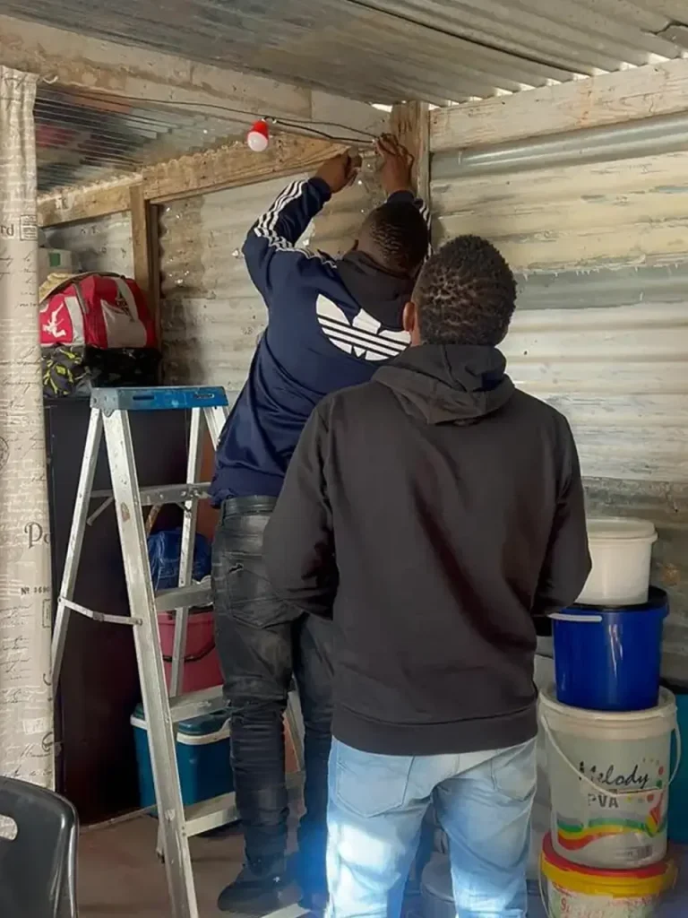 Technicians installing a system inside a home